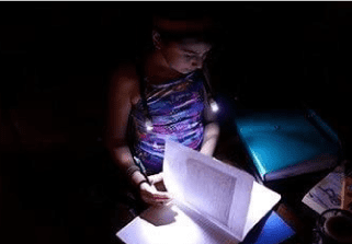 reading a book with neck light
